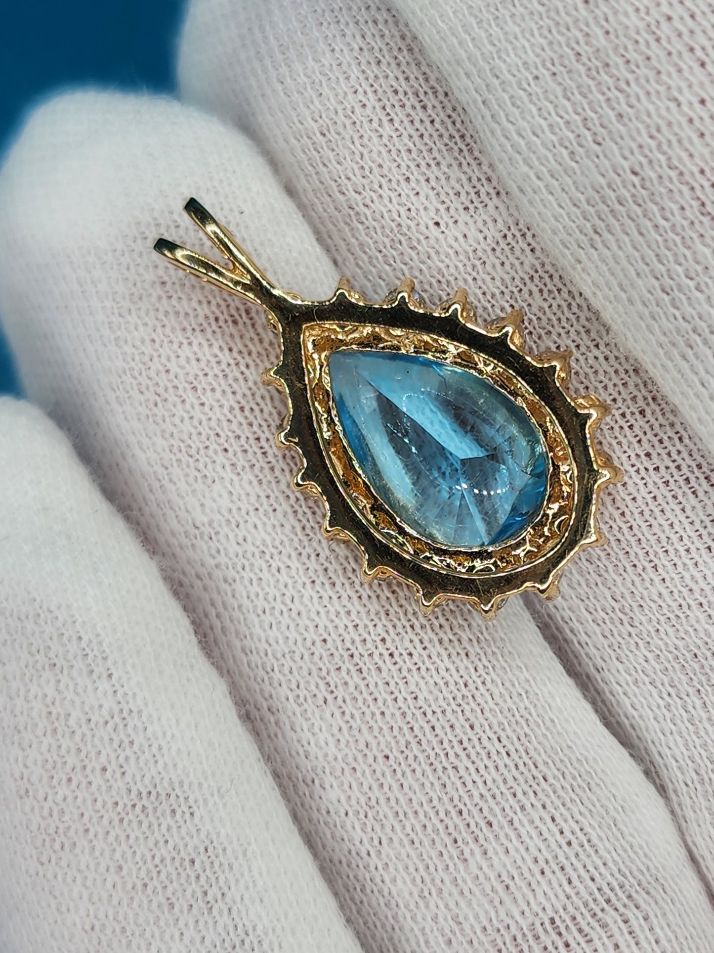 Buffed Top Pear Shape Blue Topaz and Halo Diamonds Pendant