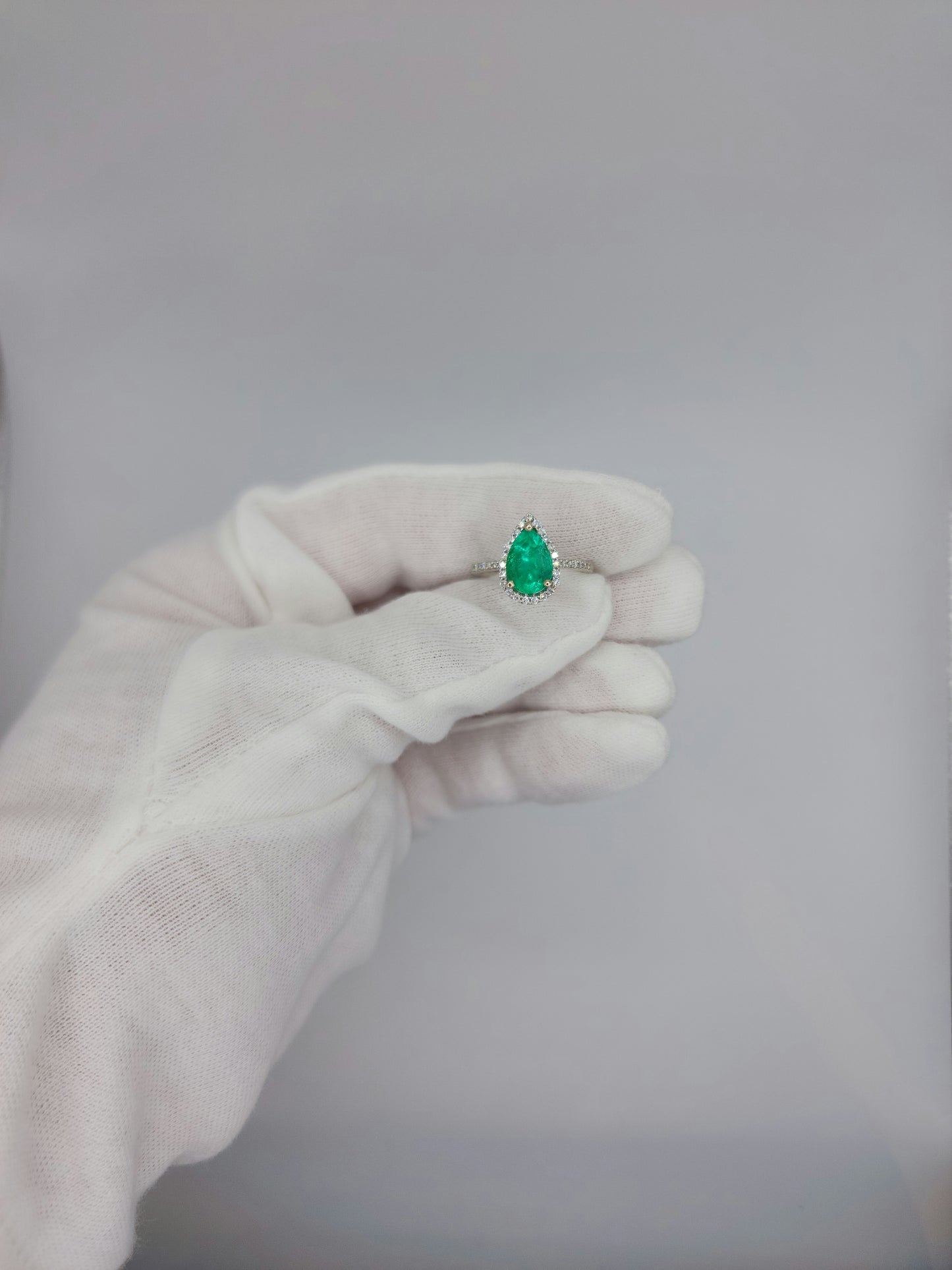 Pear Emerald and Halo Diamond Ring in 14k White Gold
