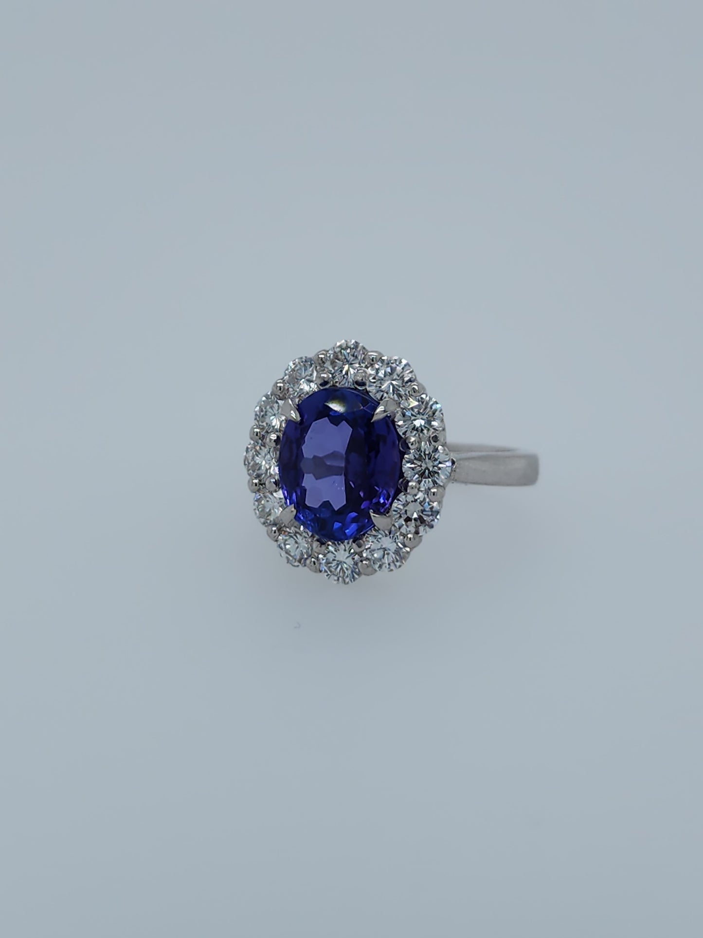 AAA Natural Oval Tanzanite and Diamond Halo Ladies Ring in 18k White Gold