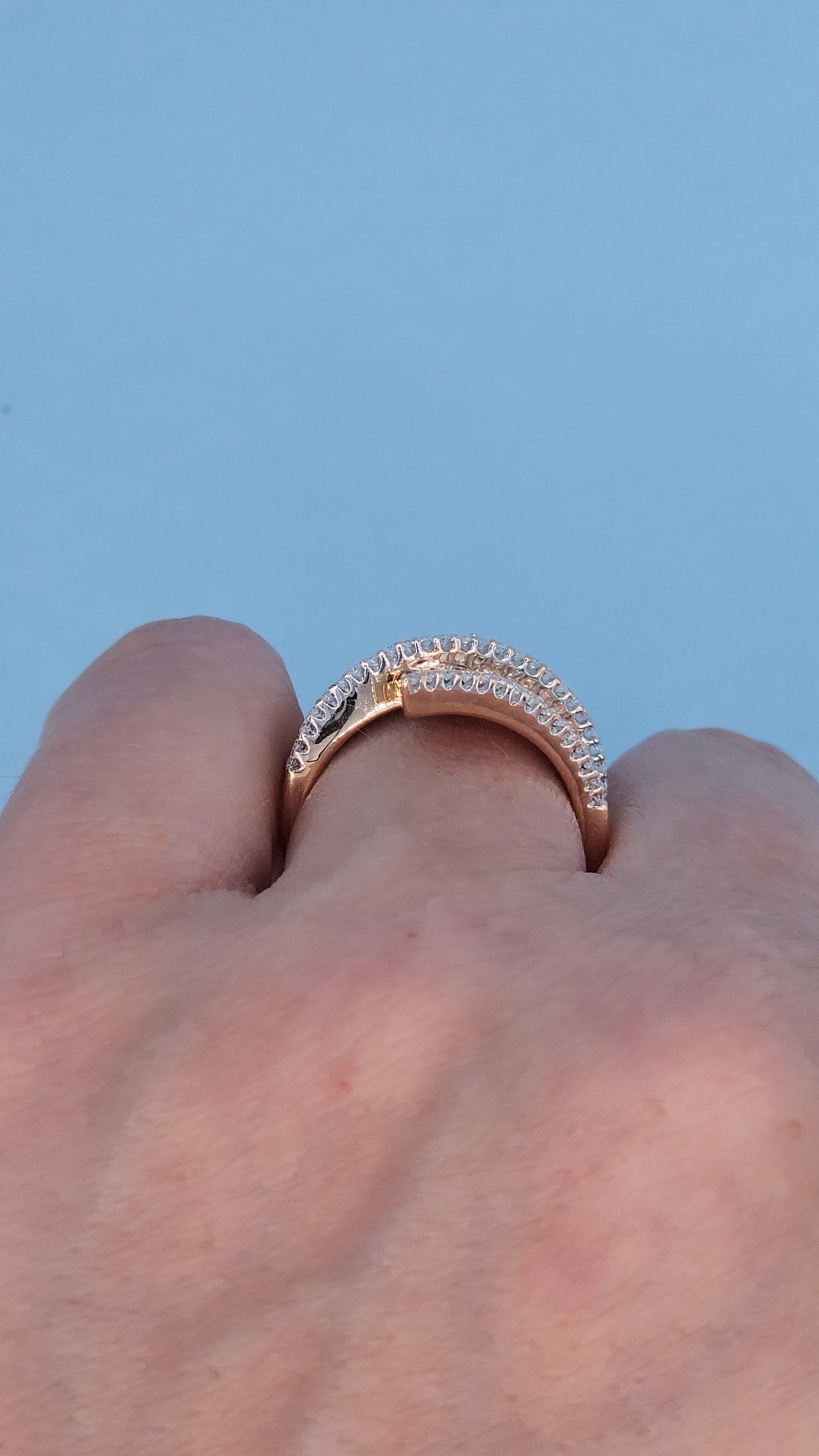 14k Rose Gold Bypass Ring with Cognac and White Diamonds on the hand from the side