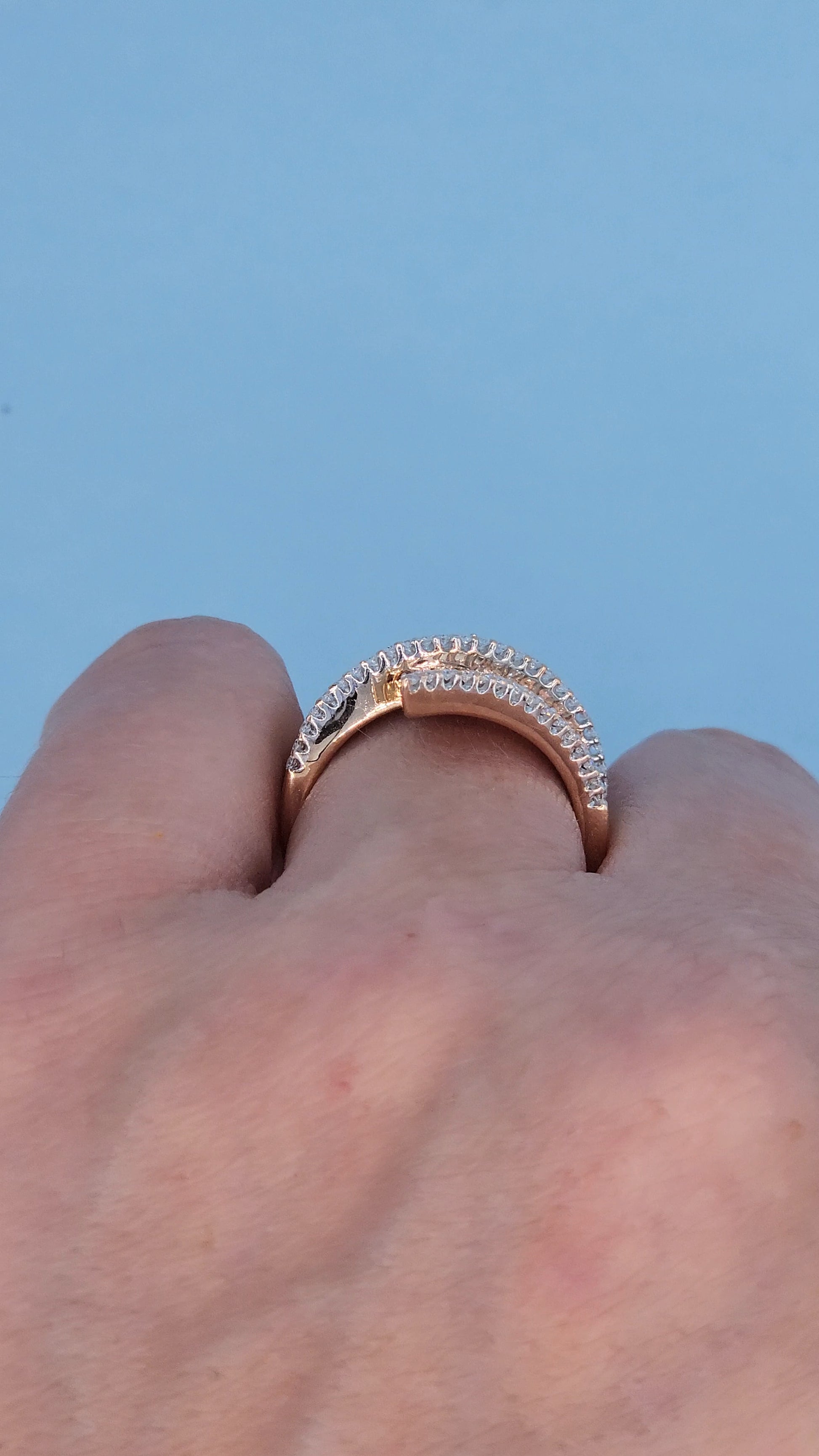 14k Rose Gold Bypass Ring with Cognac and White Diamonds on the hand from the side
