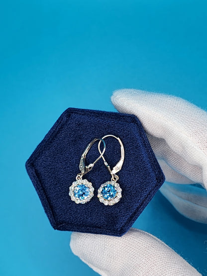 Blue Topaz and Halo Diamonds Dangling Earrings in 14k White Gold