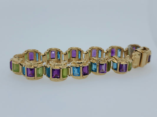 Emeral Cut Peridot, Amethyst and Swiss Blue Topaz Bracelet in 14k Yellow Gold