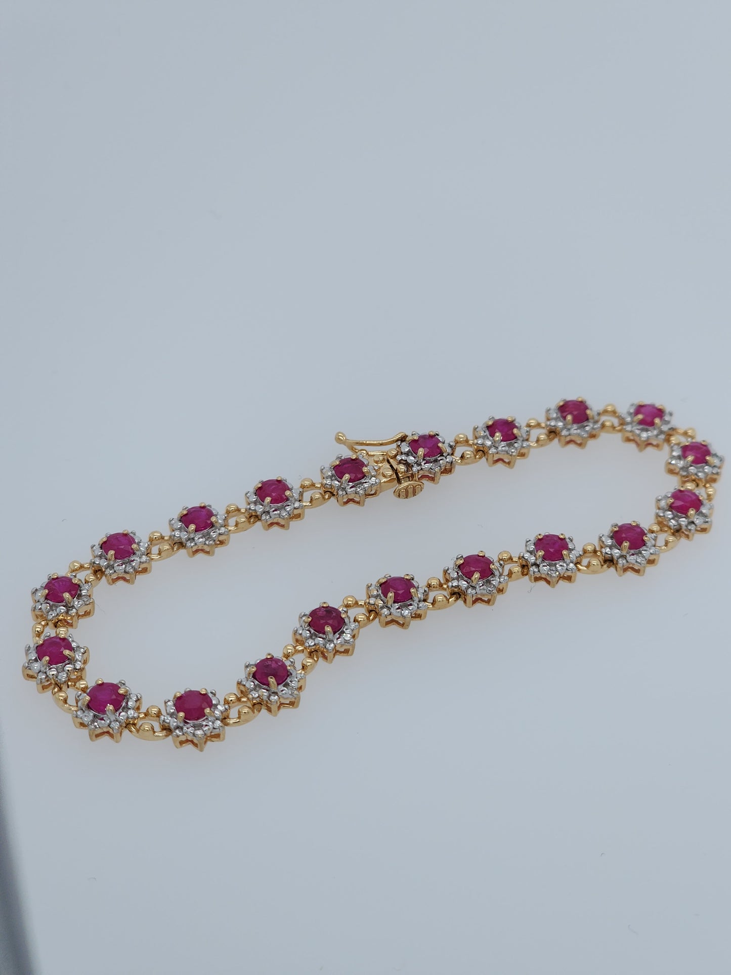 Ladies Flower Motif Ruby and Diamond Tennis Bracelet in 14k Yellow Gold