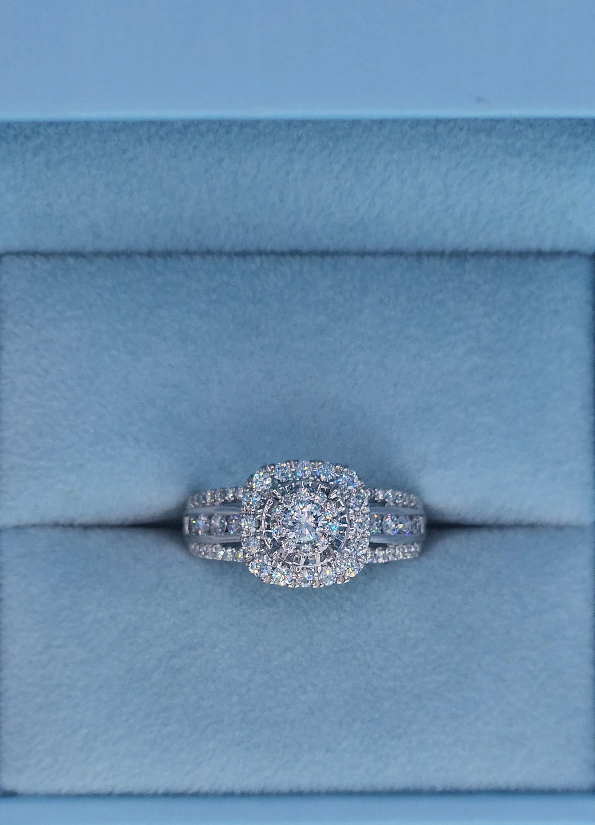 10k white gold diamond engagement ring with cushion-shaped double halo and three-row shank, 1 carat total diamond weight, size 7, cluster setting.