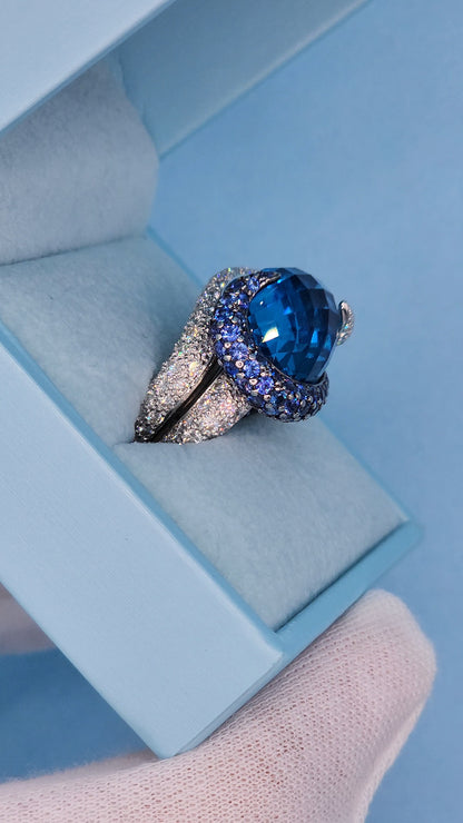 Large Cocktail Ring with Blue Topaz Center Accented by Diamond and Sapphire Swirl in 18k White Gold