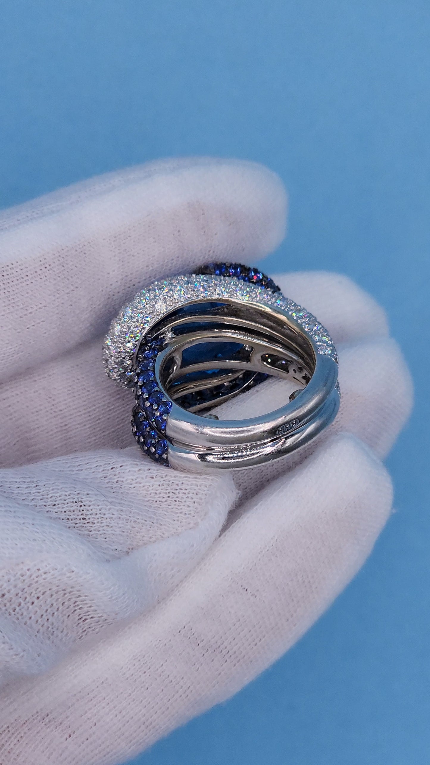 Large Cocktail Ring with Blue Topaz Center Accented by Diamond and Sapphire Swirl in 18k White Gold