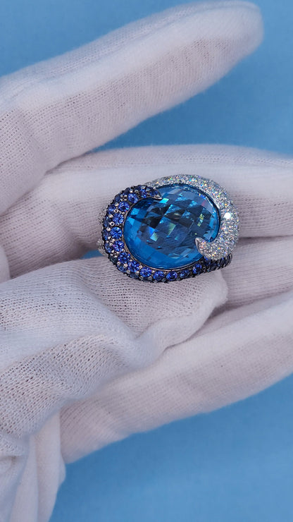 Large Cocktail Ring with Blue Topaz Center Accented by Diamond and Sapphire Swirl in 18k White Gold