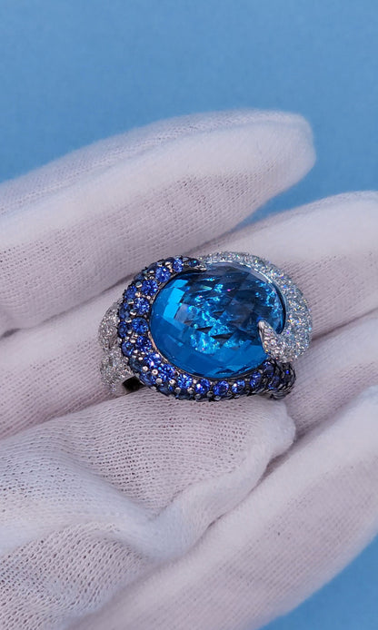 Large Cocktail Ring with Blue Topaz Center Accented by Diamond and Sapphire Swirl in 18k White Gold