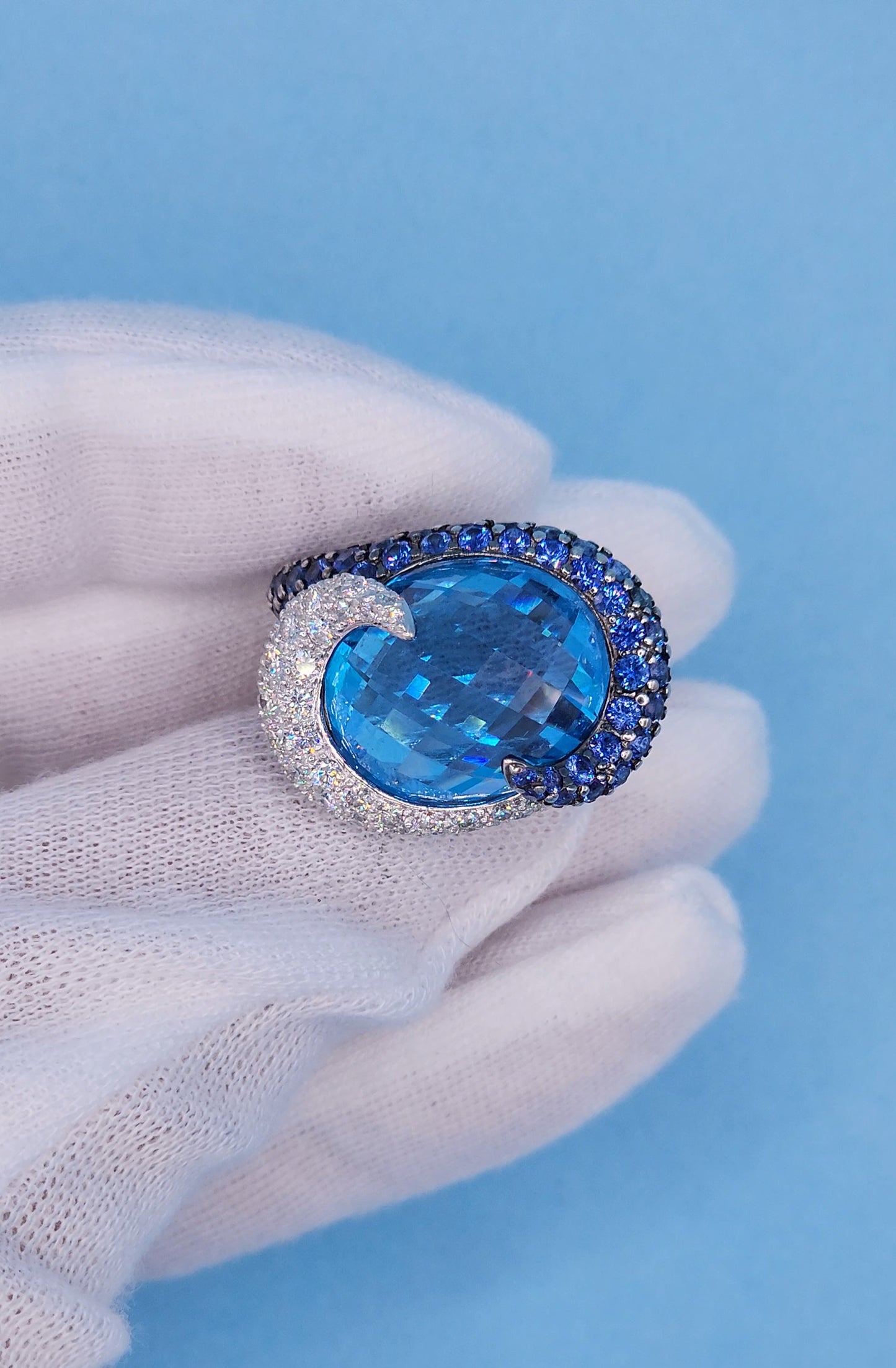 Large Cocktail Ring with Blue Topaz Center Accented by Diamond and Sapphire Swirl in 18k White Gold