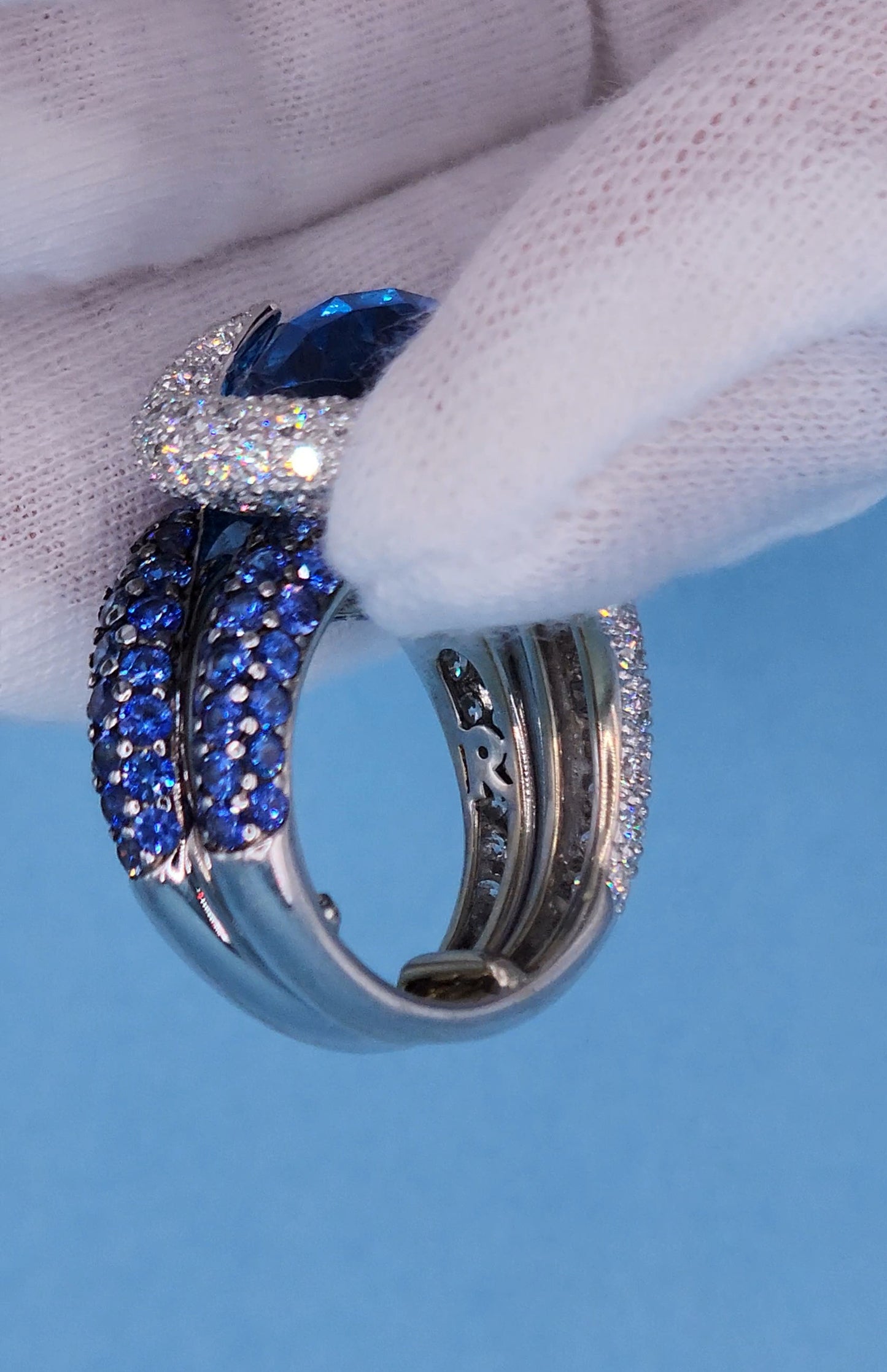 Large Cocktail Ring with Blue Topaz Center Accented by Diamond and Sapphire Swirl in 18k White Gold