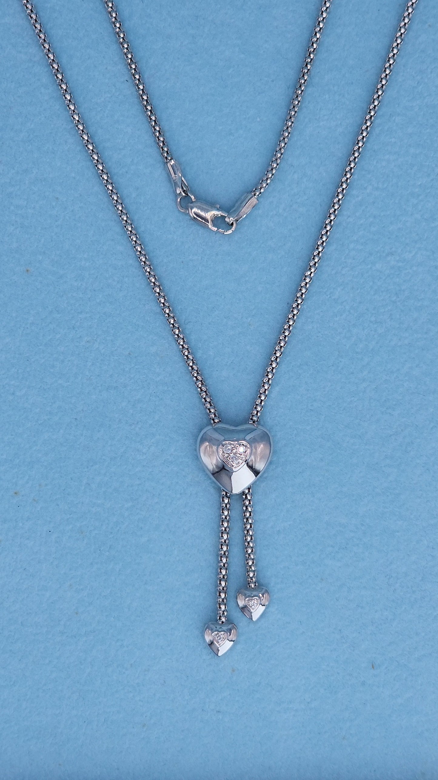 White gold heart lariat necklace with double heart drop ends and safety lobster clasp