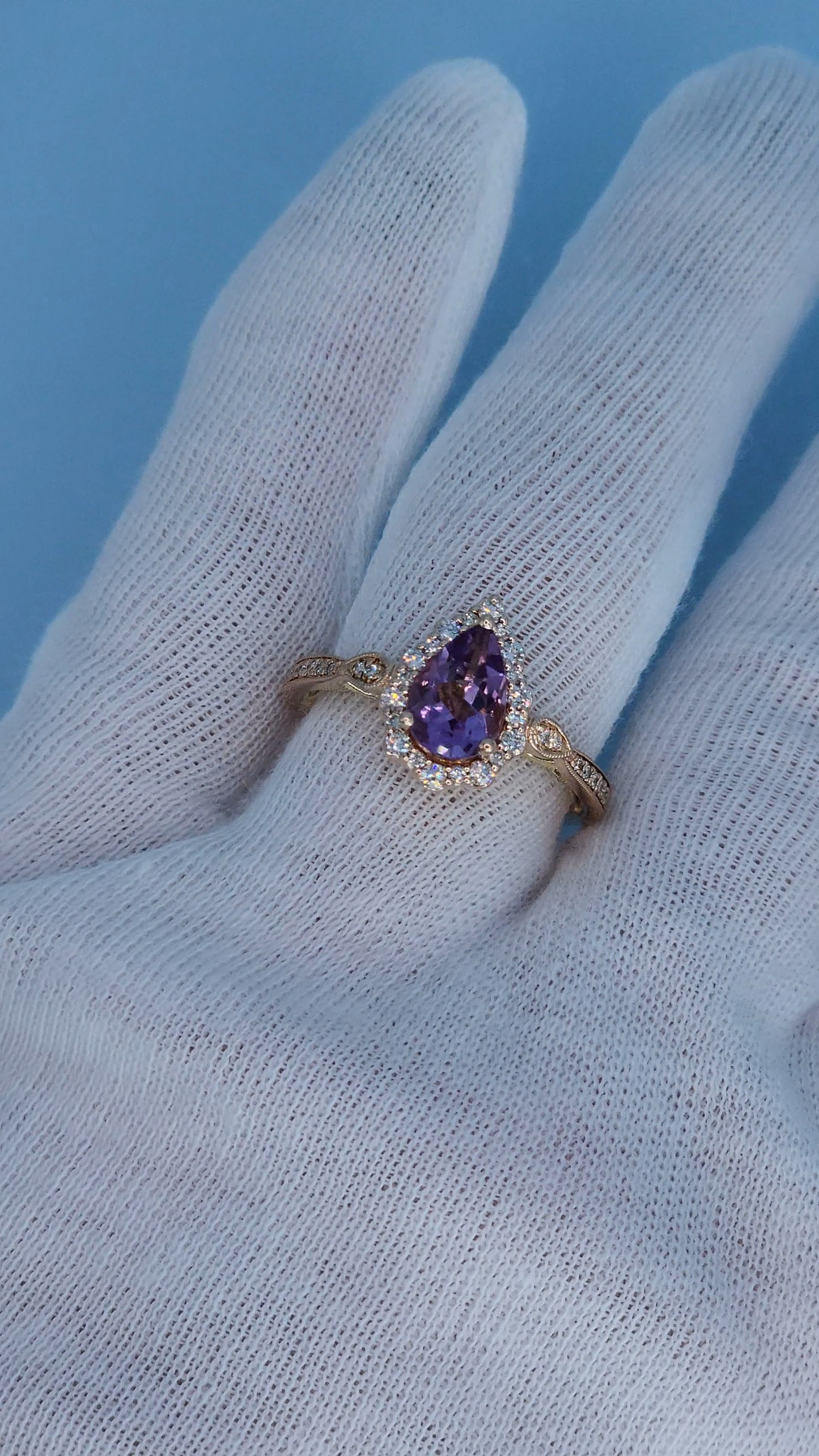 Rose gold amethyst diamond ring worn on hand