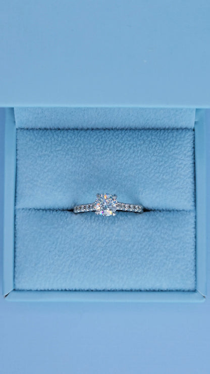 Diamond ring in a blue jewelry box