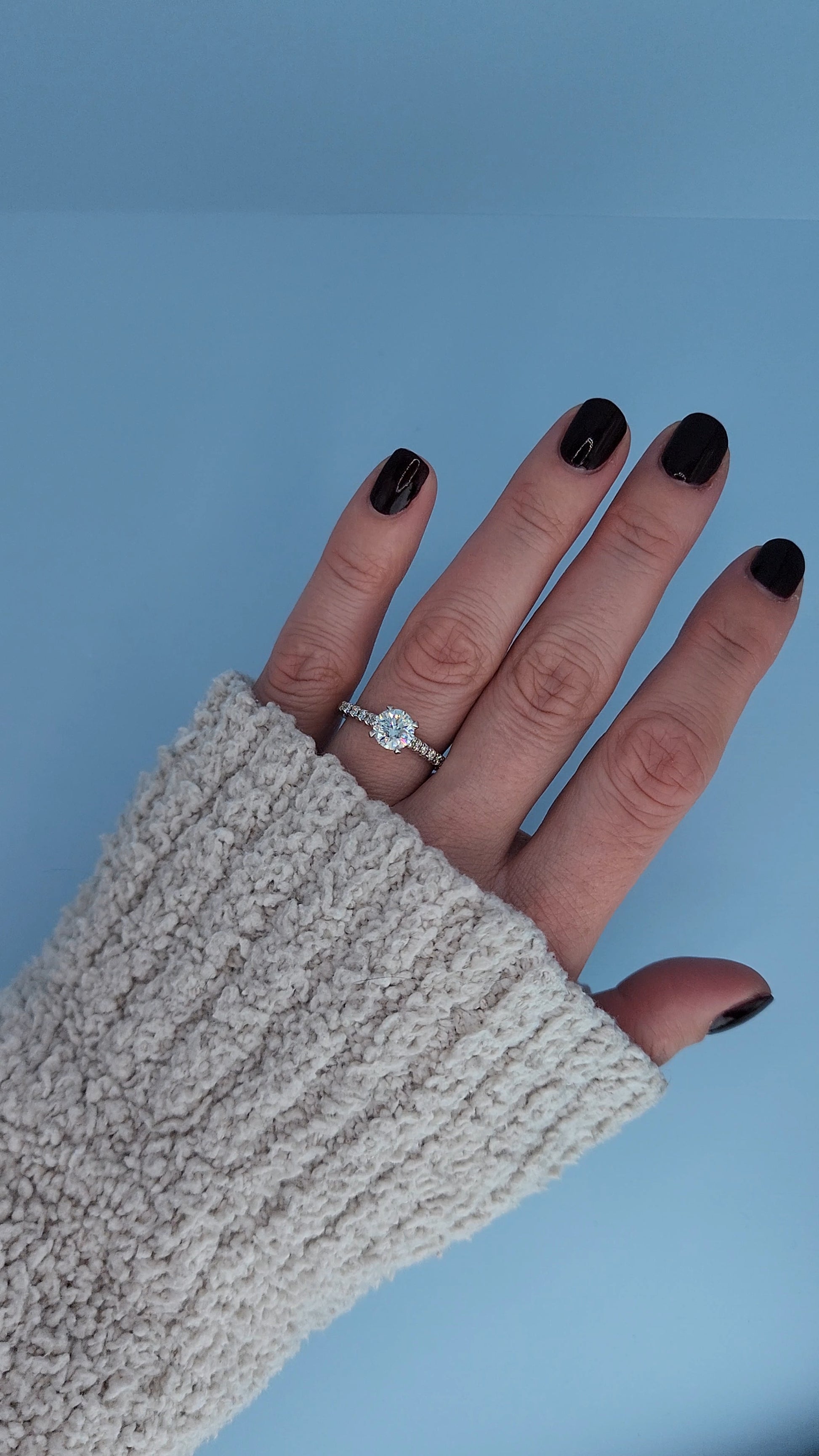Classic white gold engagement ring worn on hand
