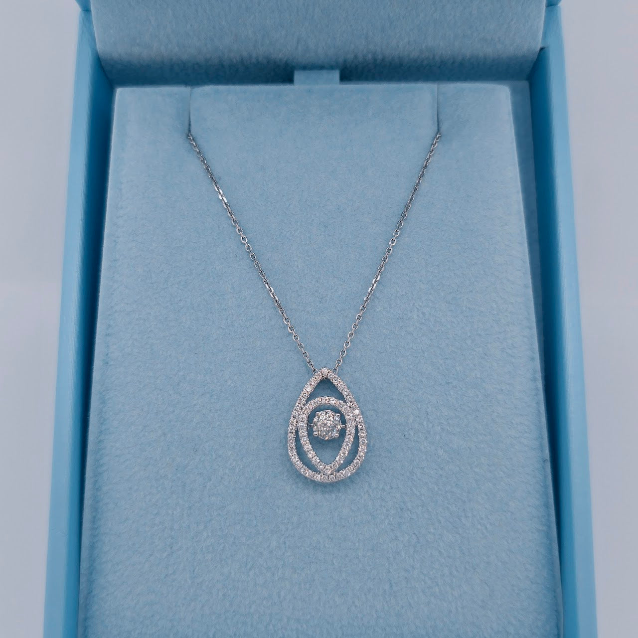 14k white gold teardrop dancing diamond pendant with rose cut floating center diamond and double halo design