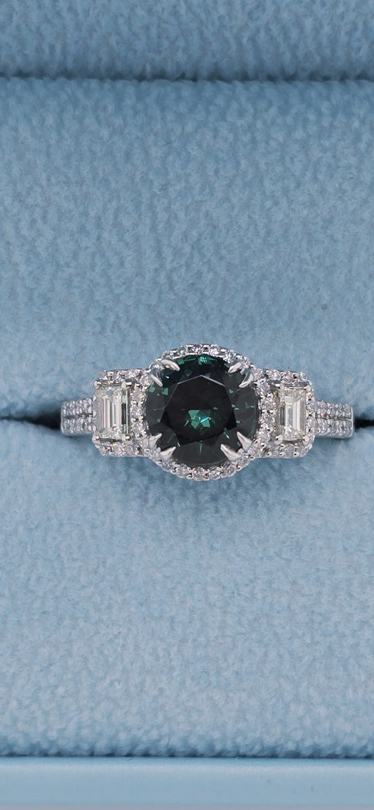 14k white gold tourmaline and diamond halo ring with baguette accents. Features a 1.40 ct green-blue tourmaline and 0.53 ct diamonds in blue box